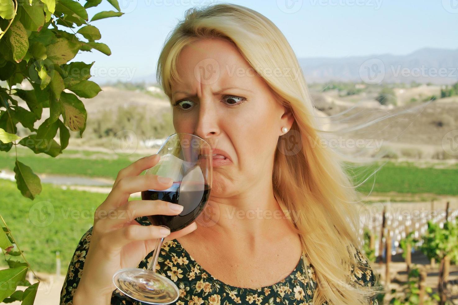 Shocked Attractive Woman Sips Wine photo