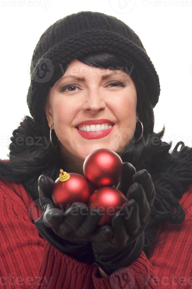 Attractive Woman Holding Red Ornaments photo