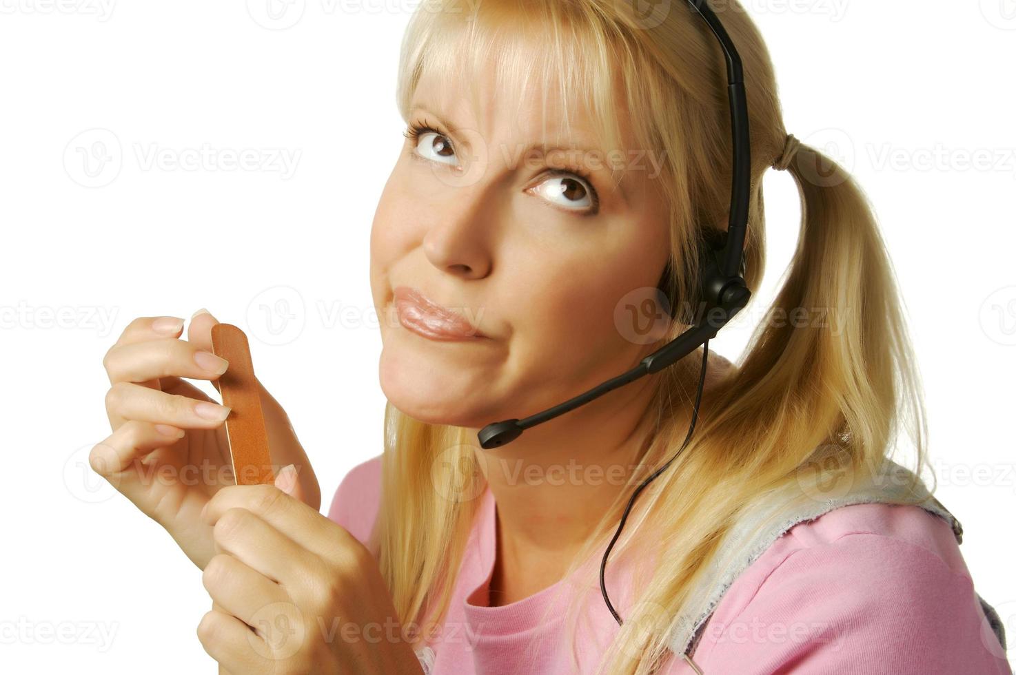 An obviously bored customer support girl. photo