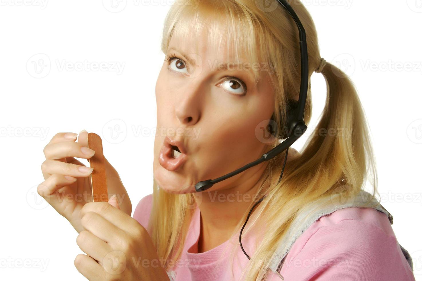 An obviously bored customer support girl. photo