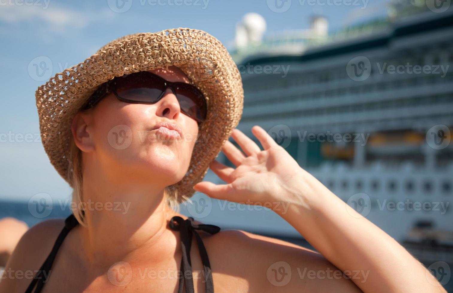 Beautiful Vacationing Woman with Cruise Ship photo