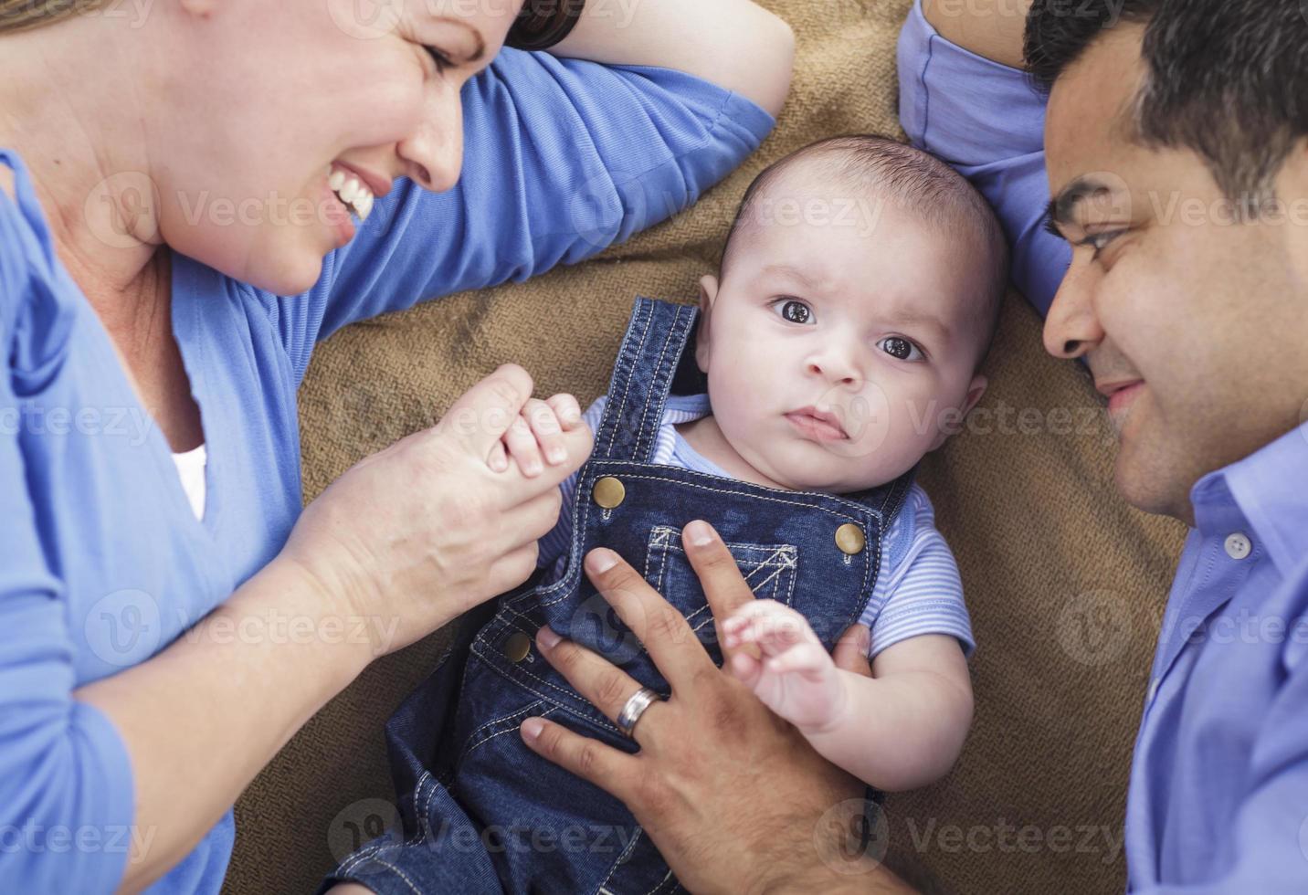 Mixed Race Family Playing on the Blanket photo