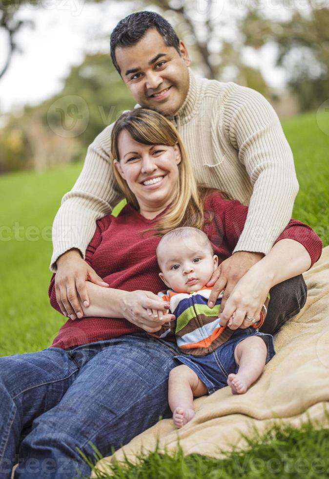 Happy Mixed Race Family Posing for A Portrait photo