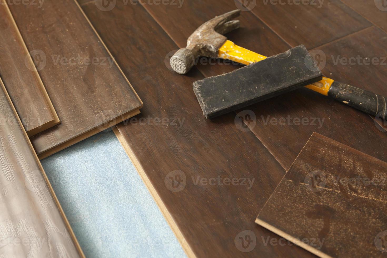 Hammer and Block with New Laminate Flooring photo