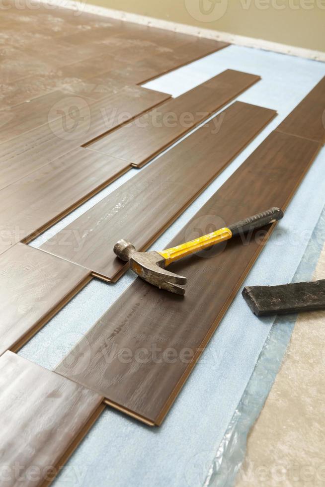 Hammer and Block with New Laminate Flooring photo