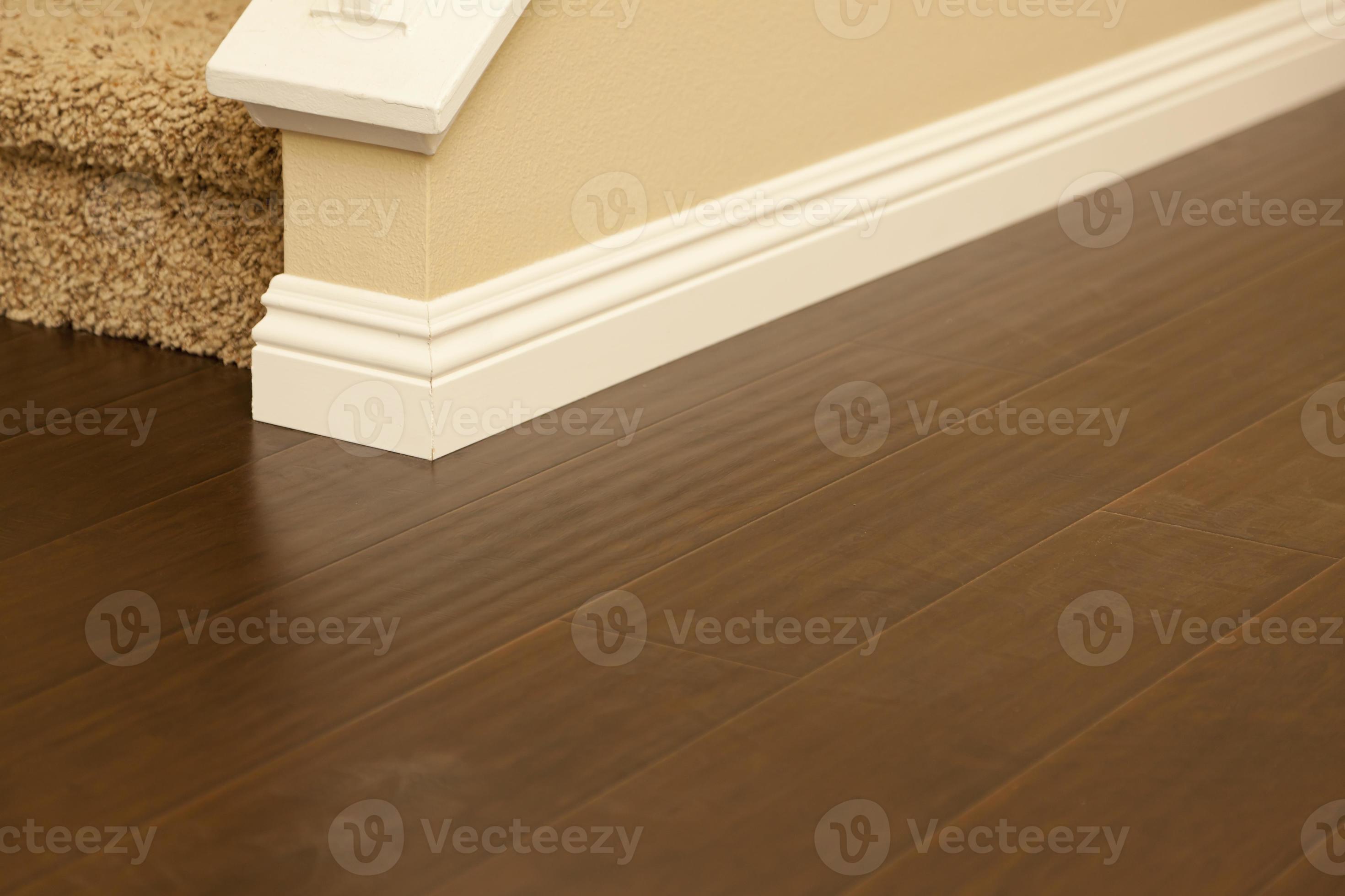 Newly Installed Brown Laminate Flooring and Baseboards in Home 16356544 Stock Photo at Vecteezy