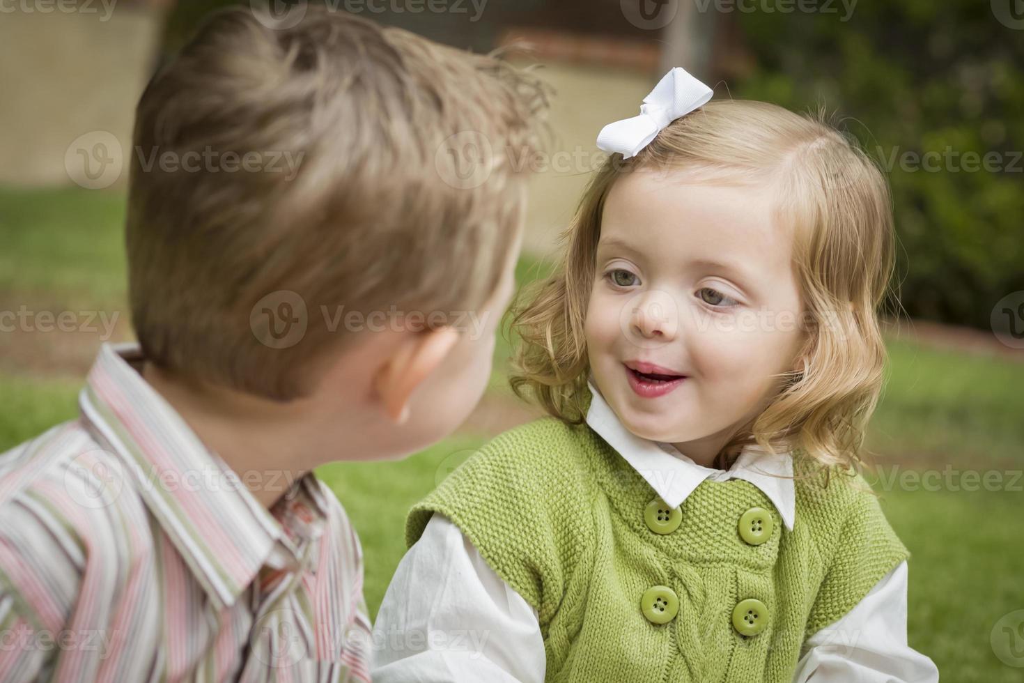 Adorable Brother and Sister Children Playing Outside photo