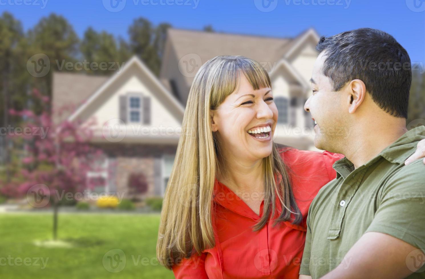 Happy Mixed Race Couple in Front of House photo