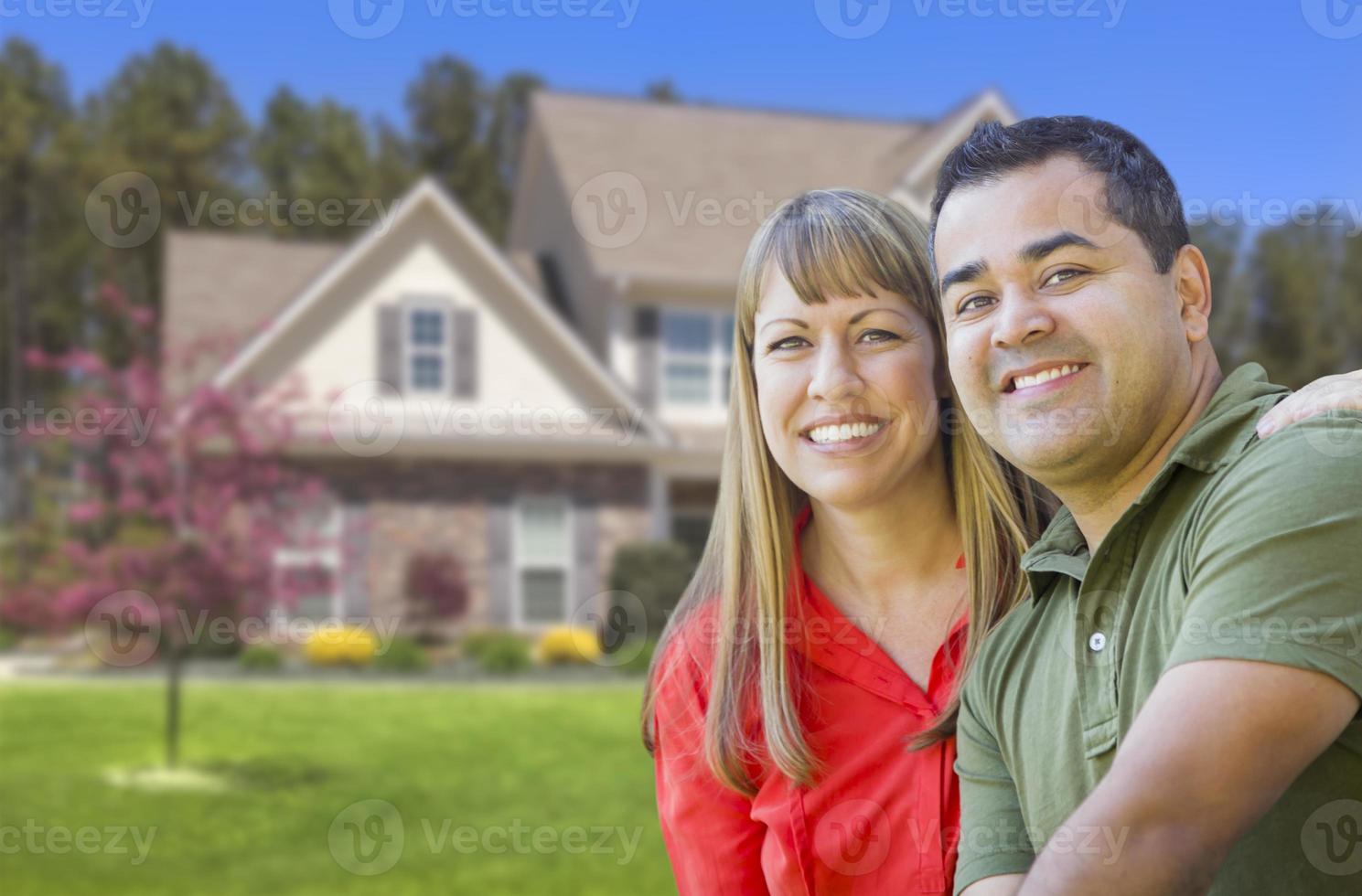 Happy Mixed Race Couple in Front of House photo