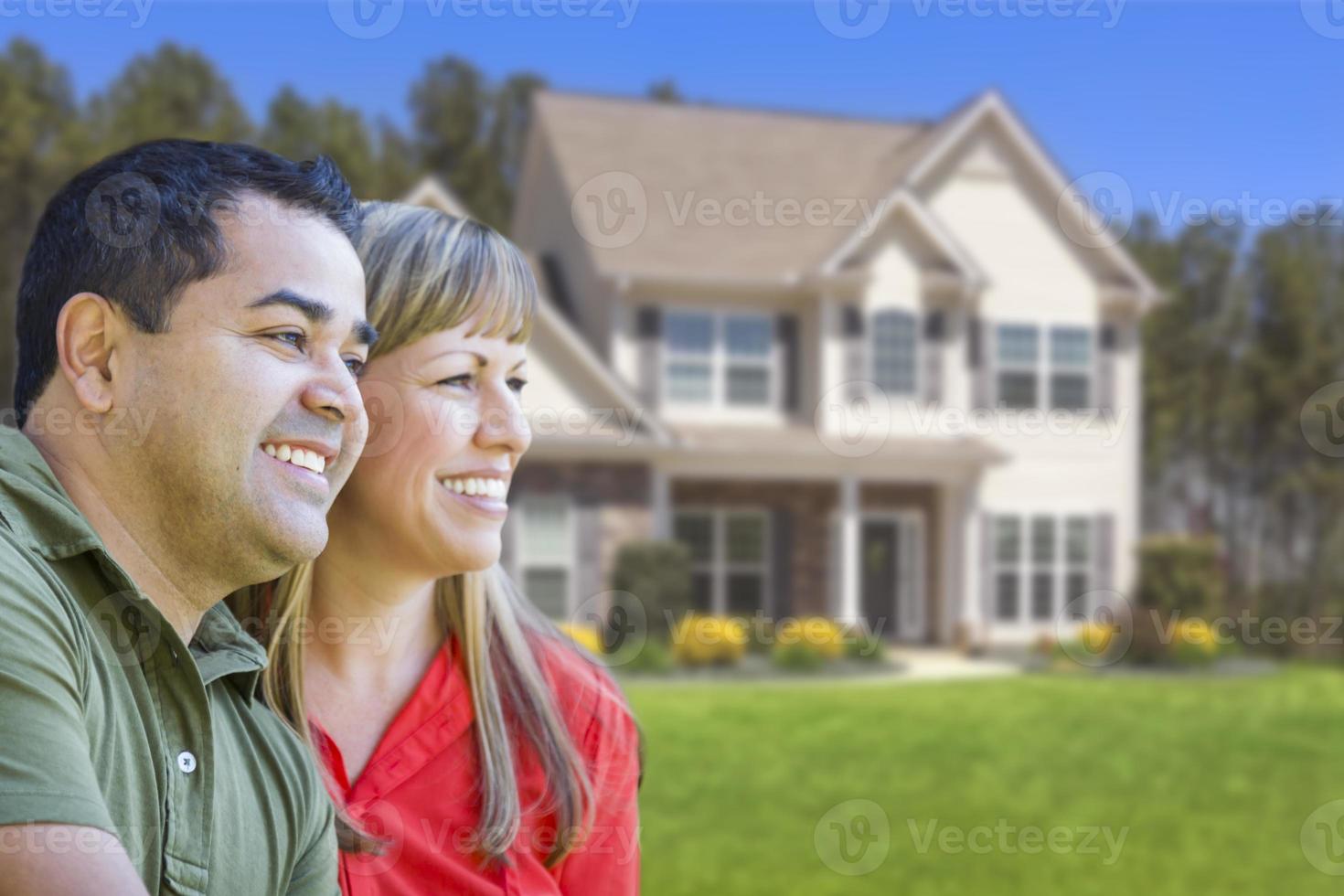 Happy Mixed Race Couple in Front of House photo