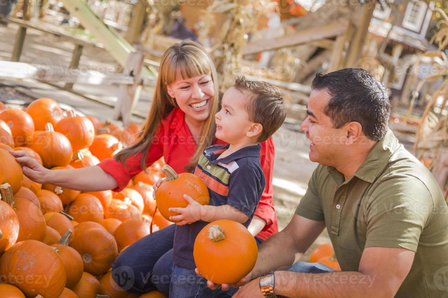 Happy Mixed Race Family at the Pumpkin Patch photo