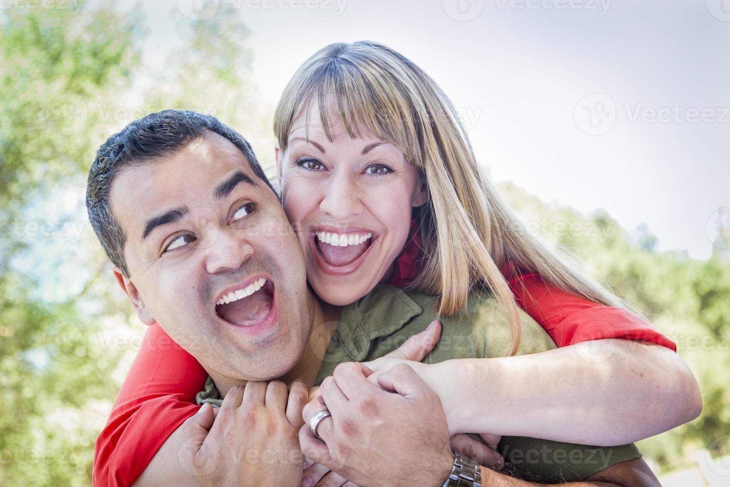 Attractive Mixed Race Couple Piggyback at the Park photo