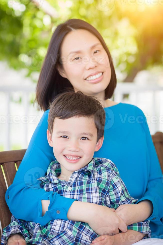 Outdoor Portrait of Chinese Mother with Her Mixed Race Chinese and Caucasian Young Boy photo