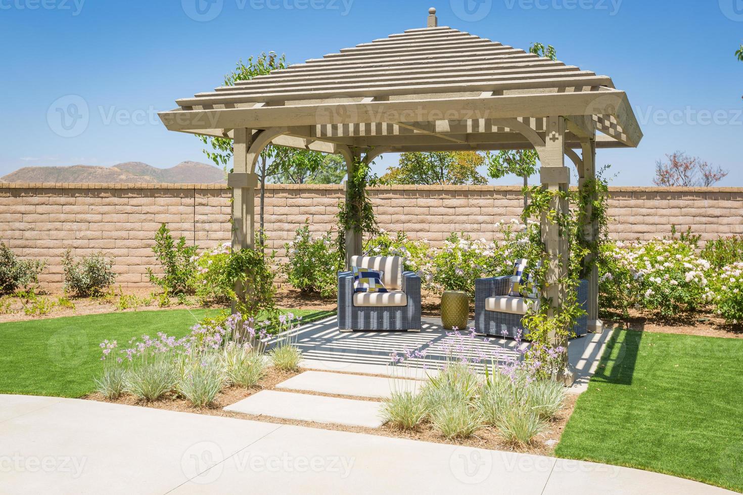 Beautiful Yard Pergola Patio Cover with Chairs. photo