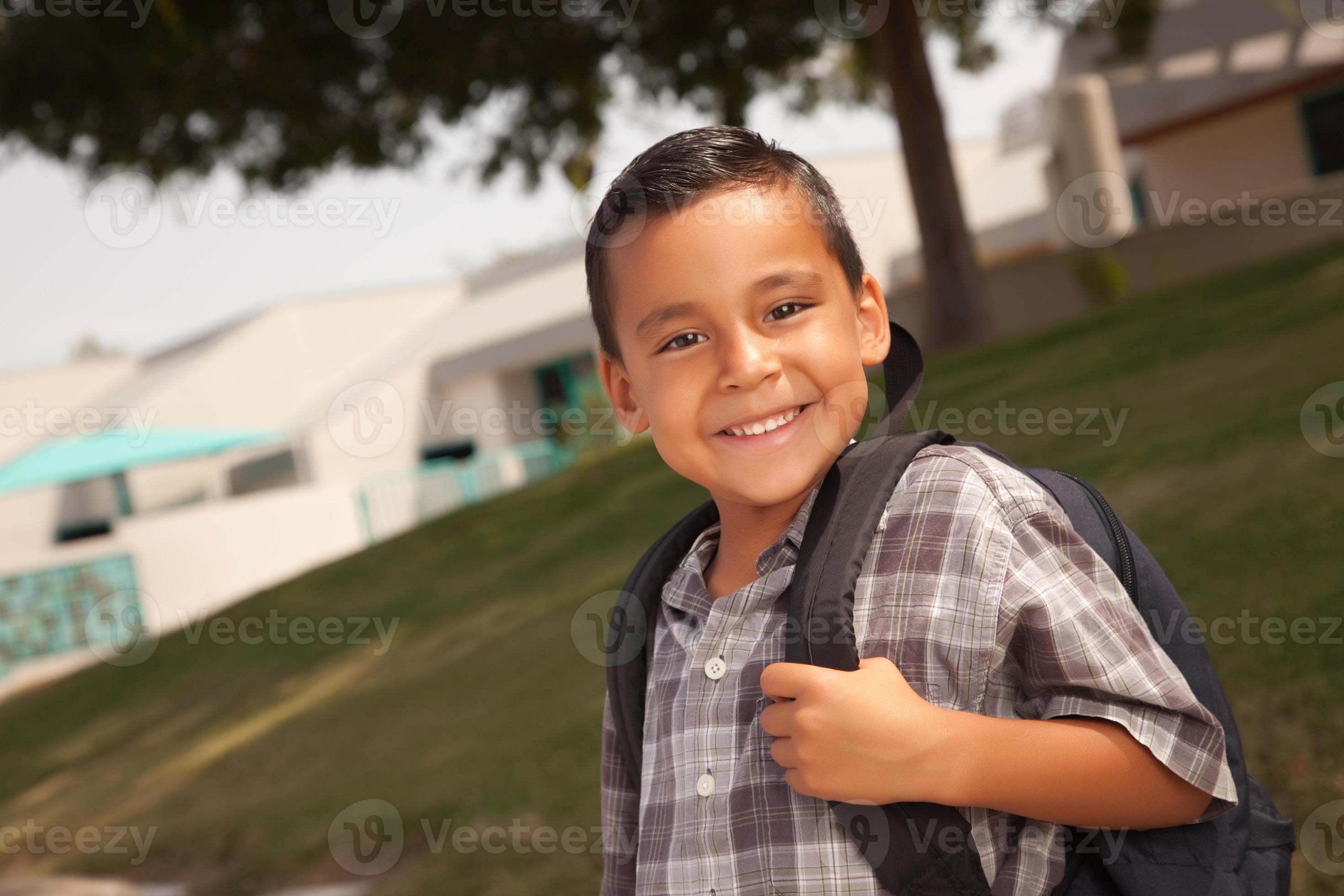 Happy Young Hispanic Boy Ready for School 16357334 Stock Photo at Vecteezy
