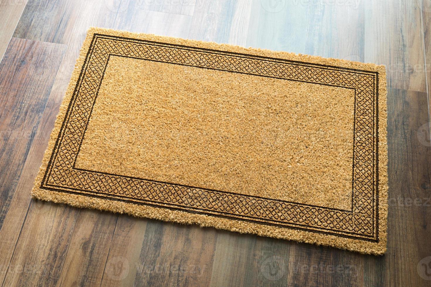 Blank Welcome Mat On Wood Floor Background Ready For Your Own Text photo