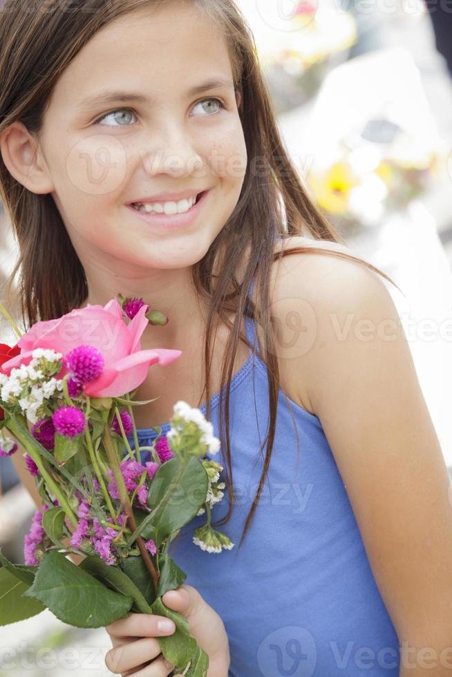 Pretty Young Girl Holding Flower Bouquet at the Market photo