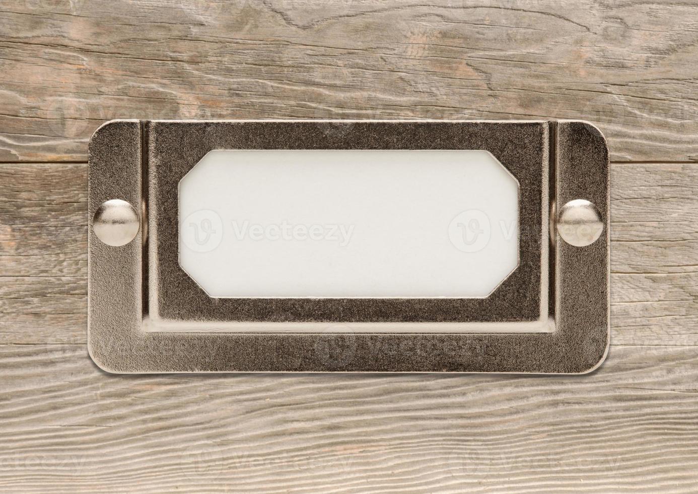 Blank Metal File Cabinet Label Frame on Wood photo
