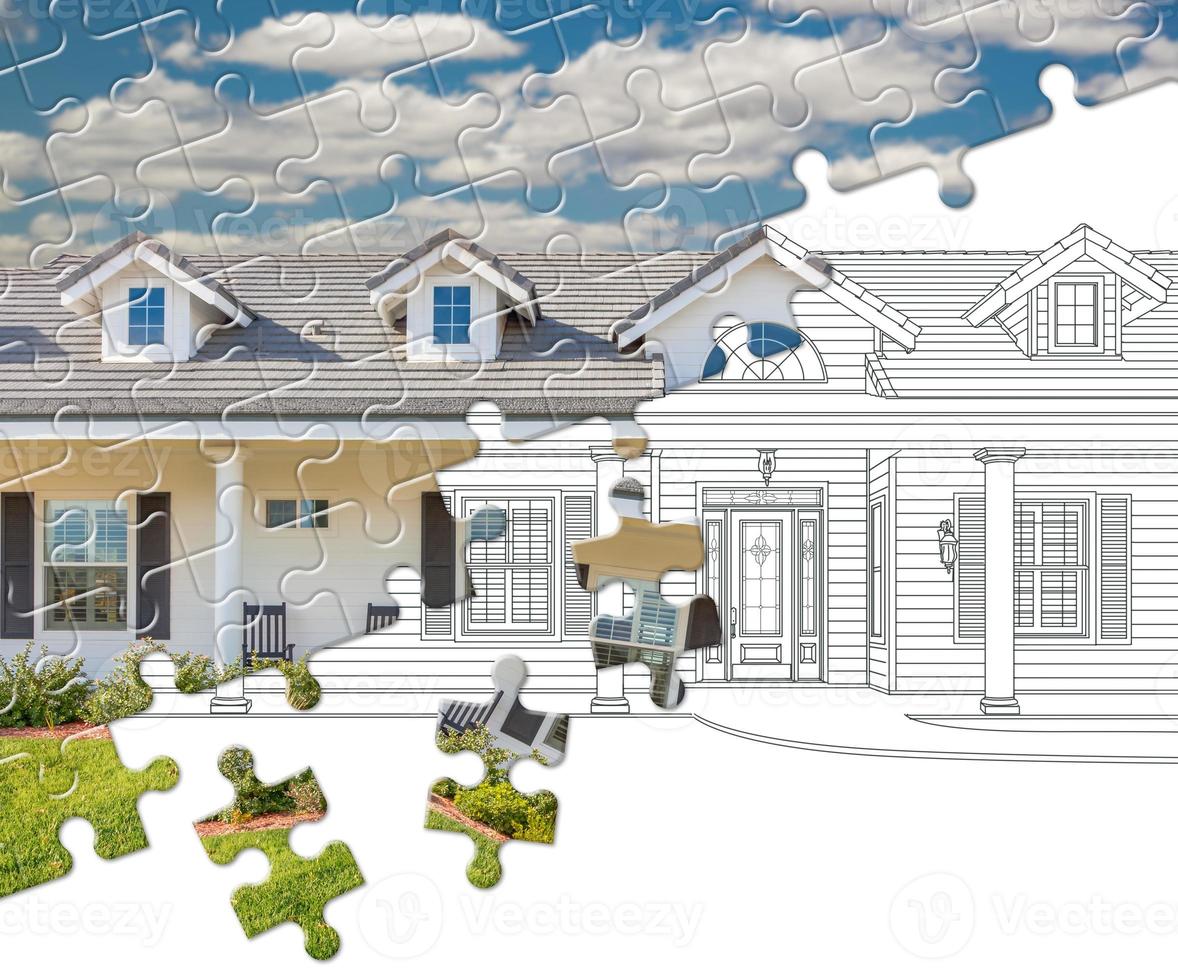 Puzzle Pieces Fitting Together Revealing Finished House Build Over Drawing photo