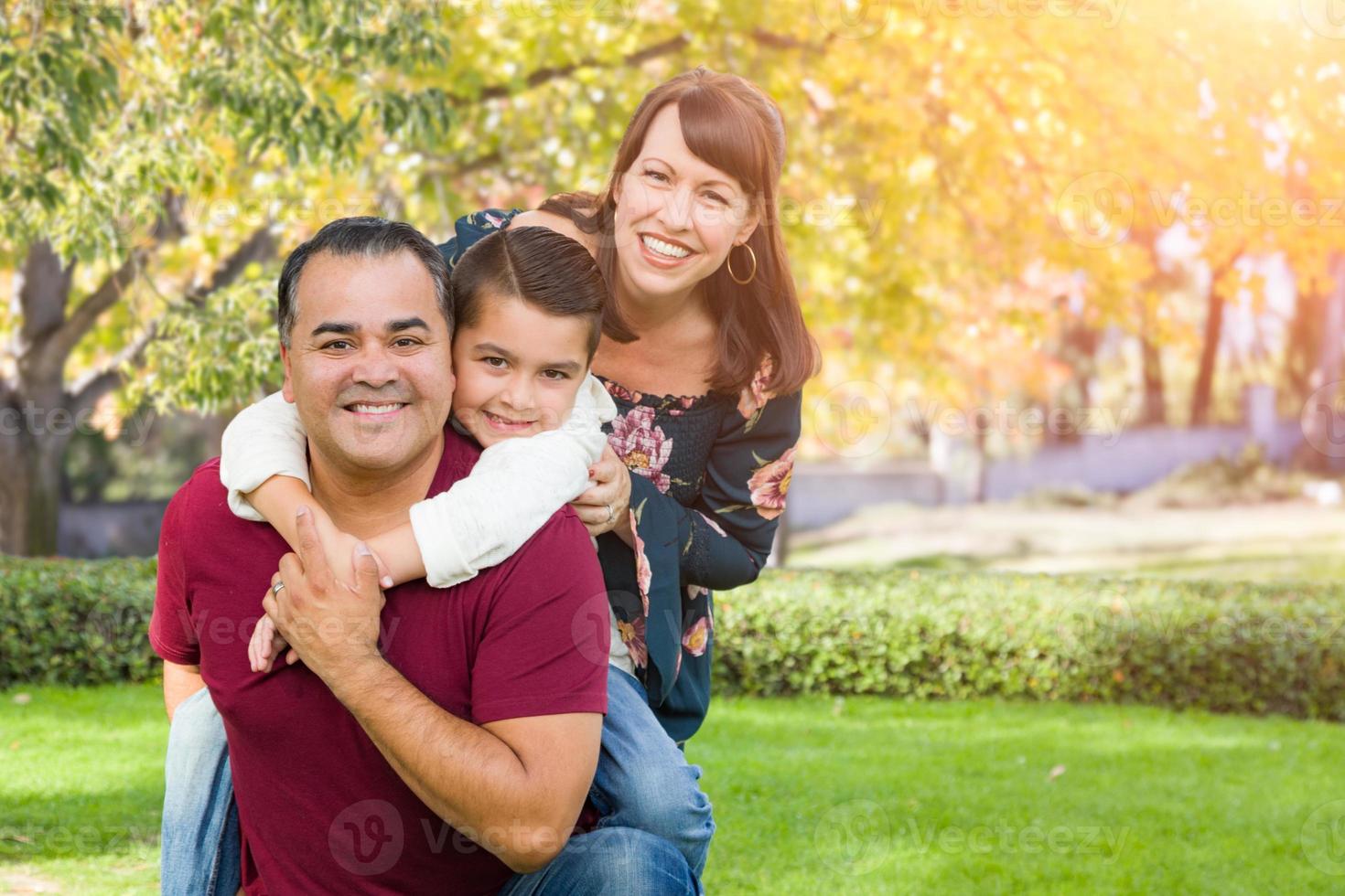 Mixed Race Young Family Portrait At The Park photo