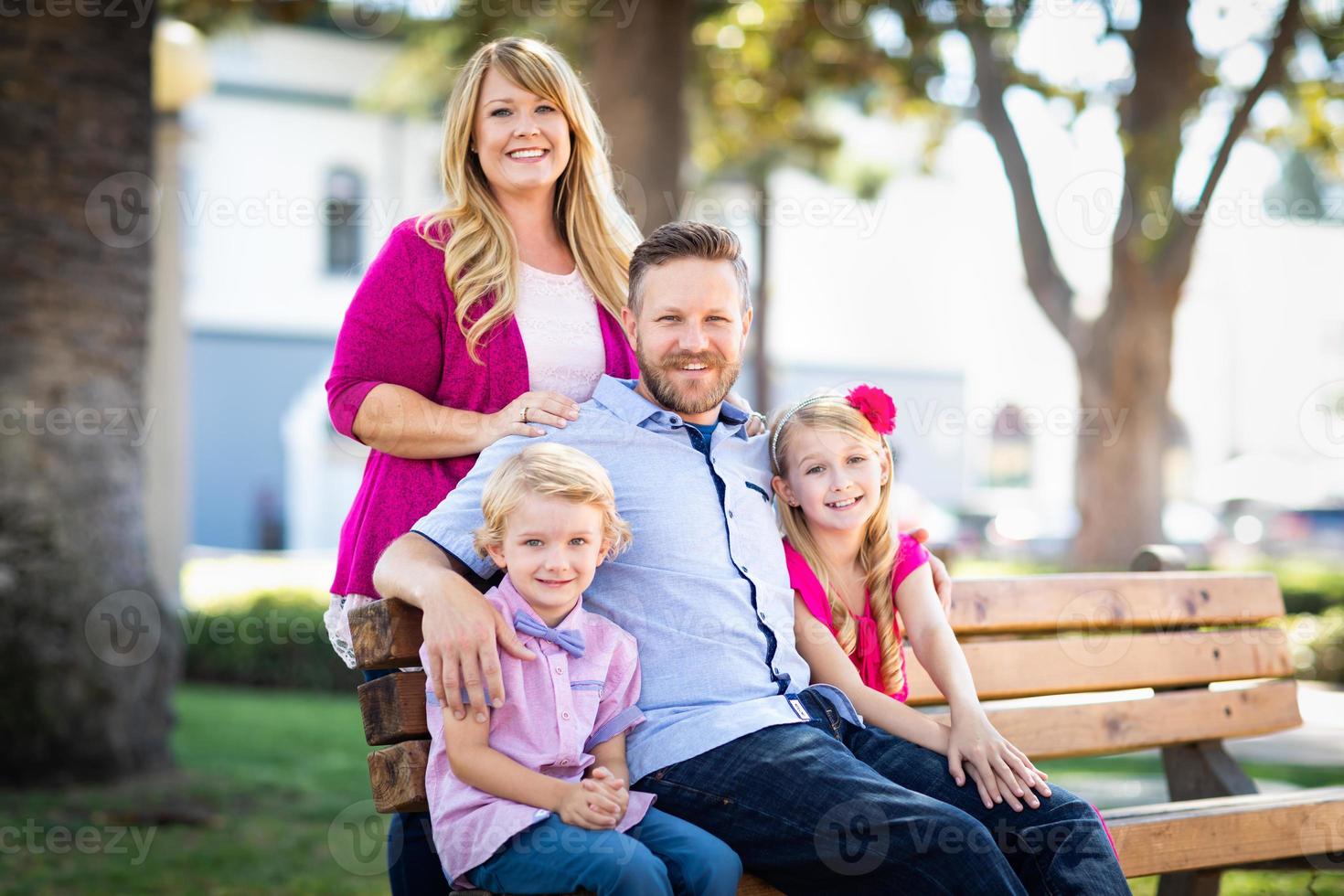 Happy Attractive Young Caucasian Family Portrait in the Park photo