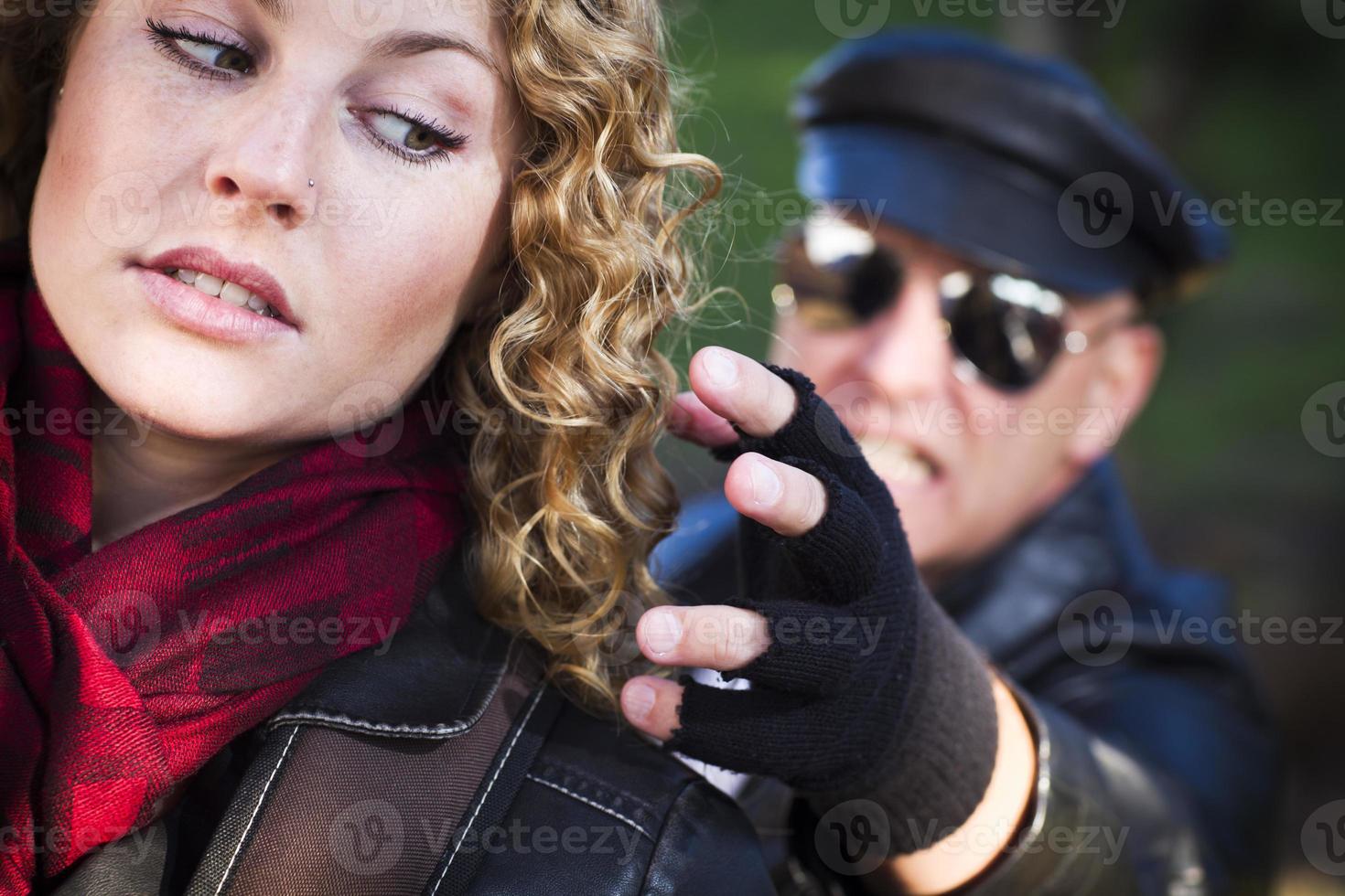 Pretty Young Teen Girl with Mysterious Man Reaching to Grab Her photo