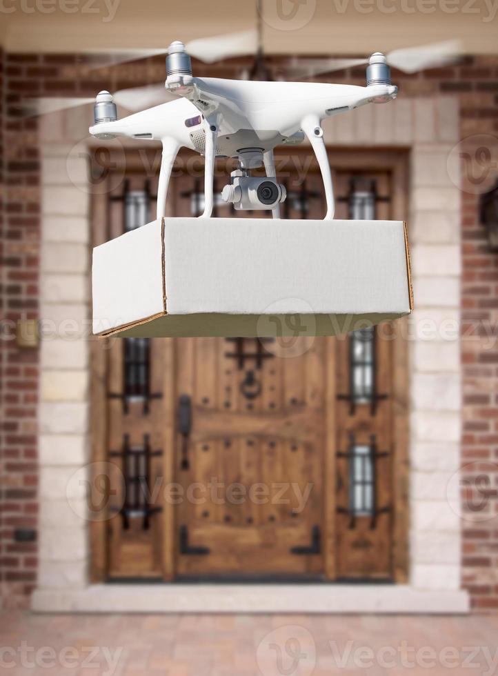 Unmanned Aircraft System UAV Quadcopter Drone Delivering Package At House photo