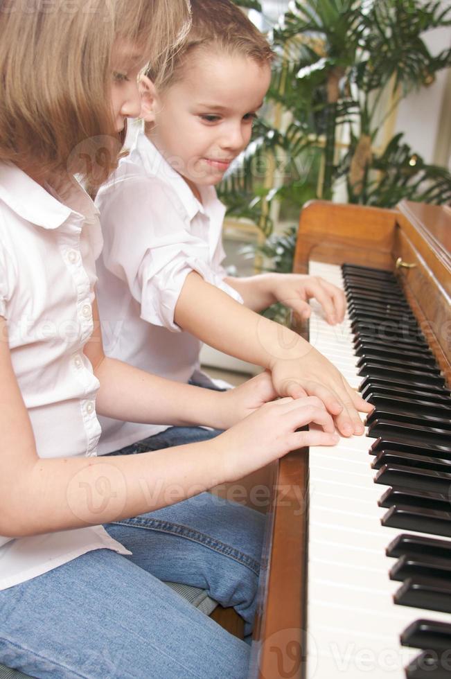 Children Playing the Piano photo