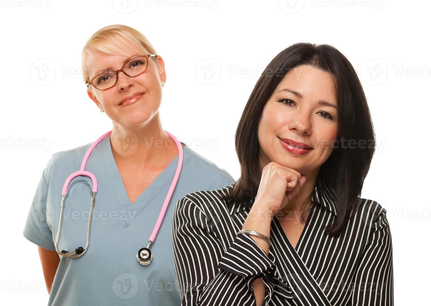 Hispanic Woman with Female Doctor or Nurse photo