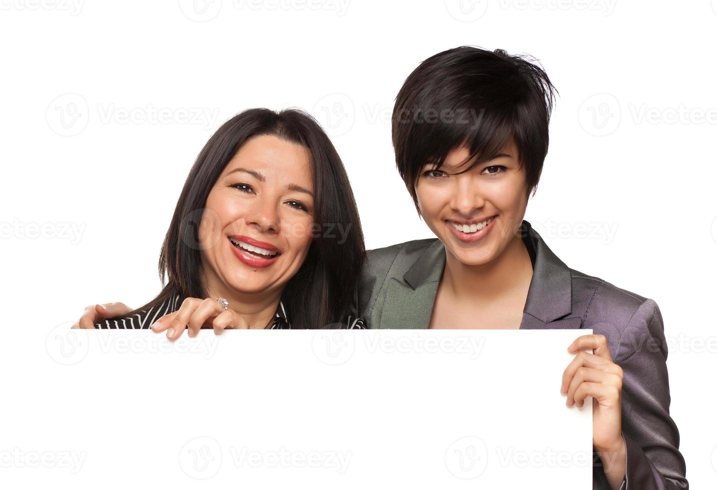 Attractive Multiethnic Mother and Daughter Holding Blank White Sign photo