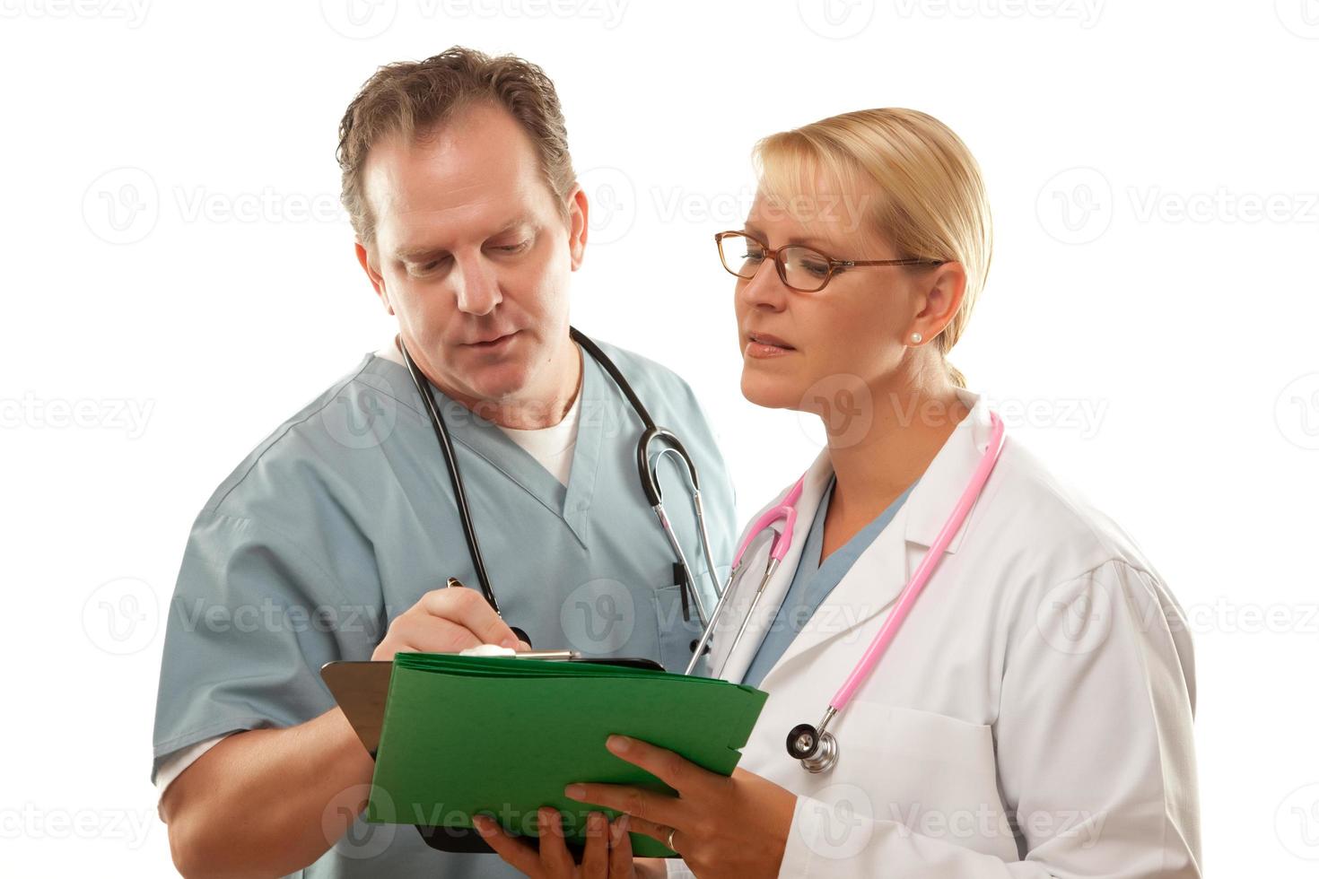 Male and Female Doctors Looking Over Files photo