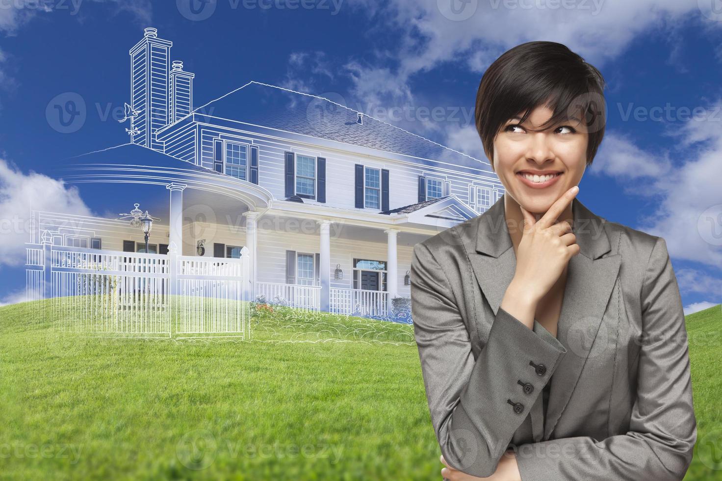 Mixed Race Woman Looks to Ghosted House Drawing Behind photo