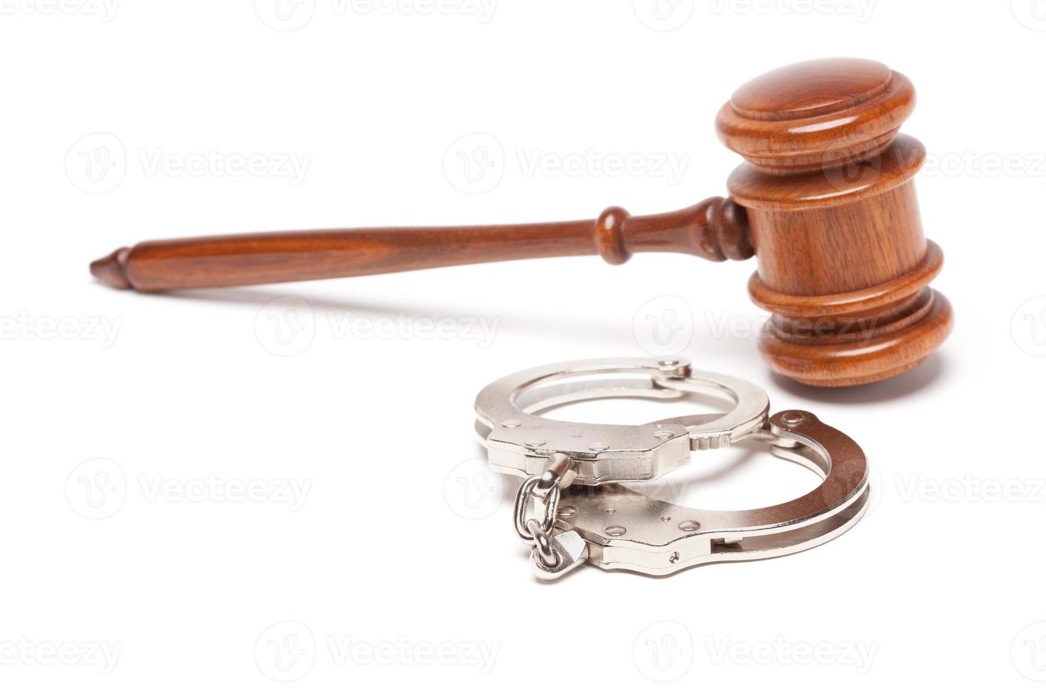 Gavel and Handcuffs on White photo