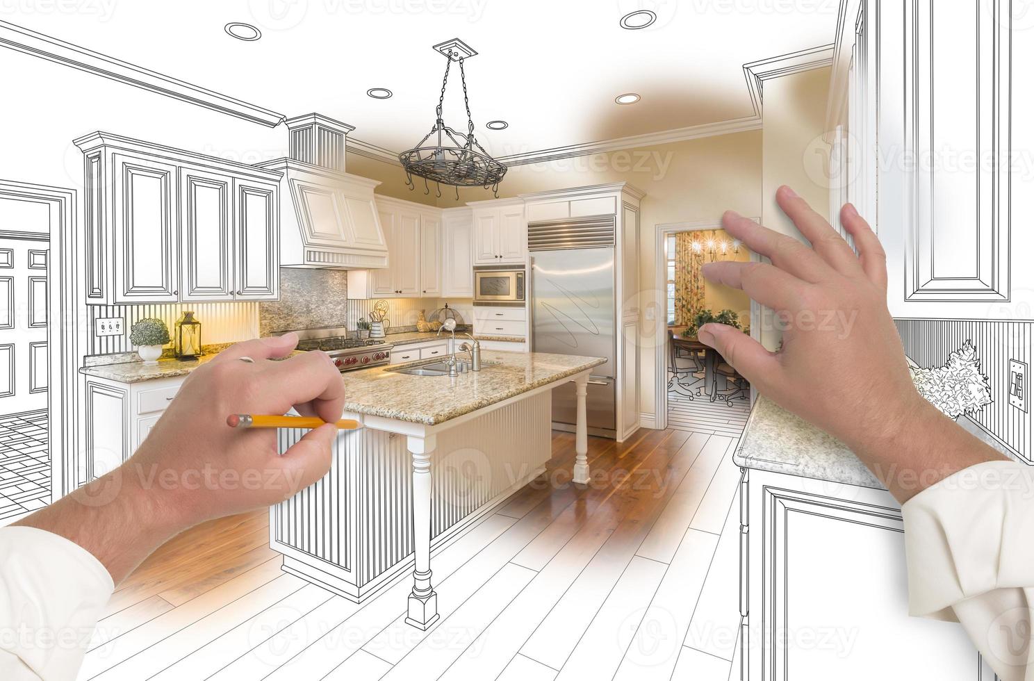Male Hands Sketching Custom Kitchen with Photo Showing Through