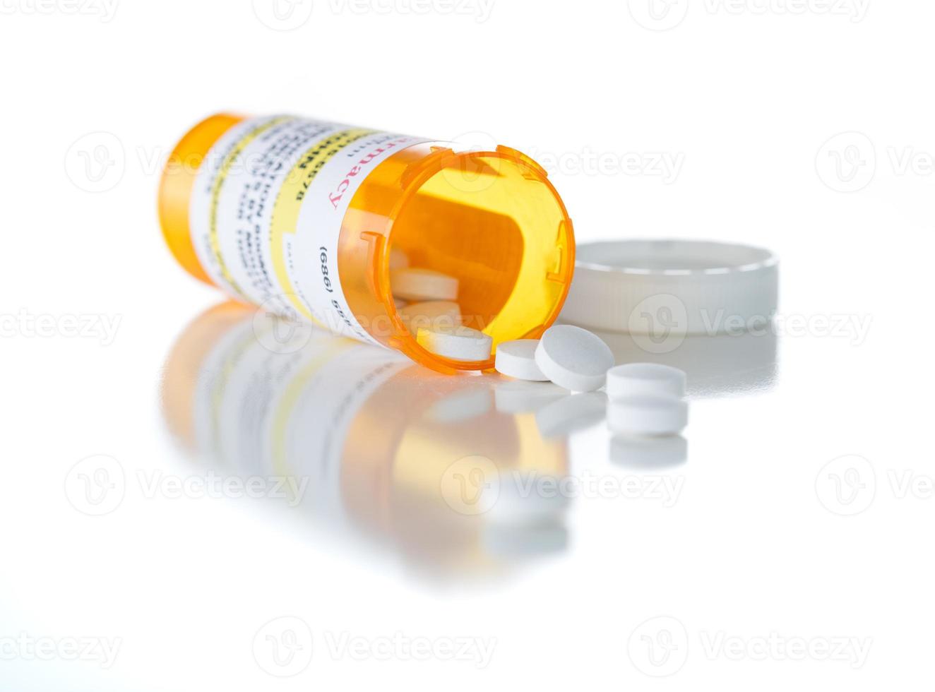 Non-Proprietary Medicine Prescription Bottle and Spilled Pills Isolated on White photo