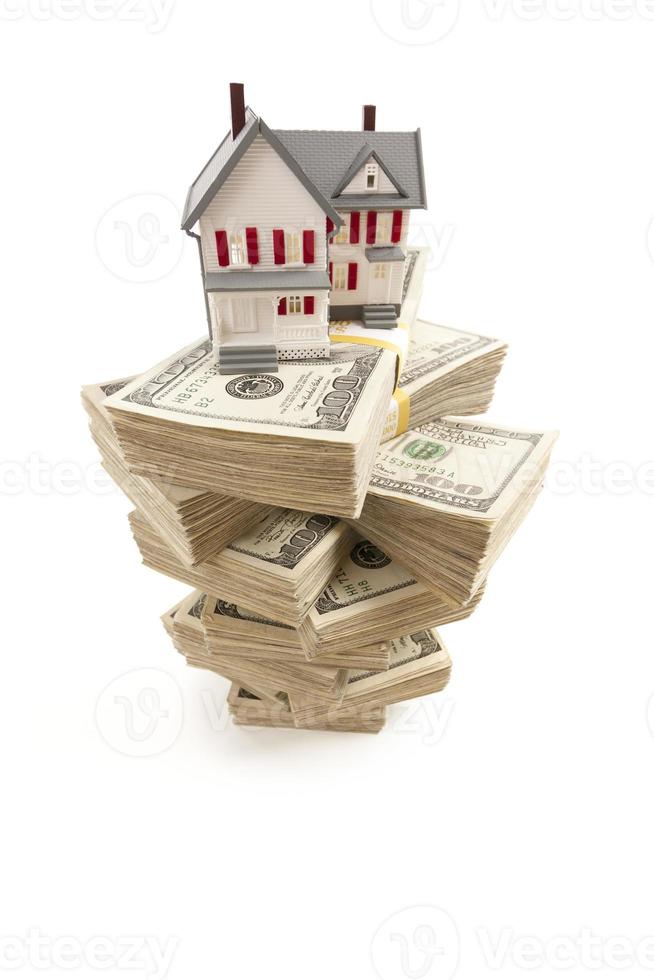 Small House on Stacks of Hundred Dollar Bills photo