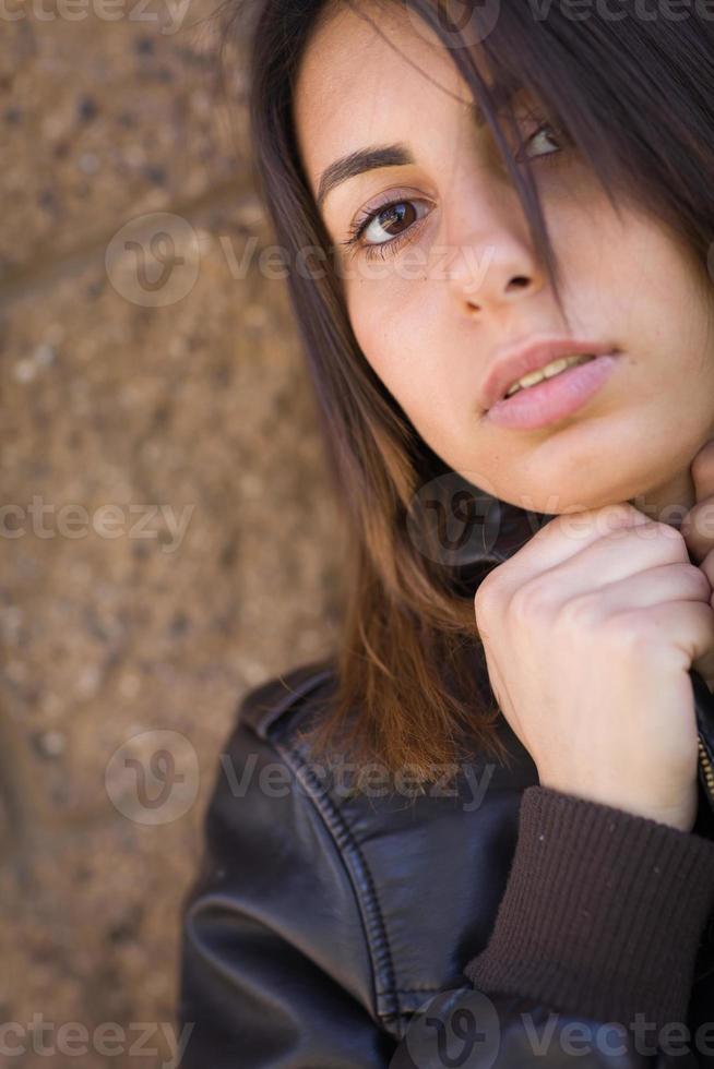 Beautiful Meloncholy Mixed Race Young Woman Portrait Outside. photo