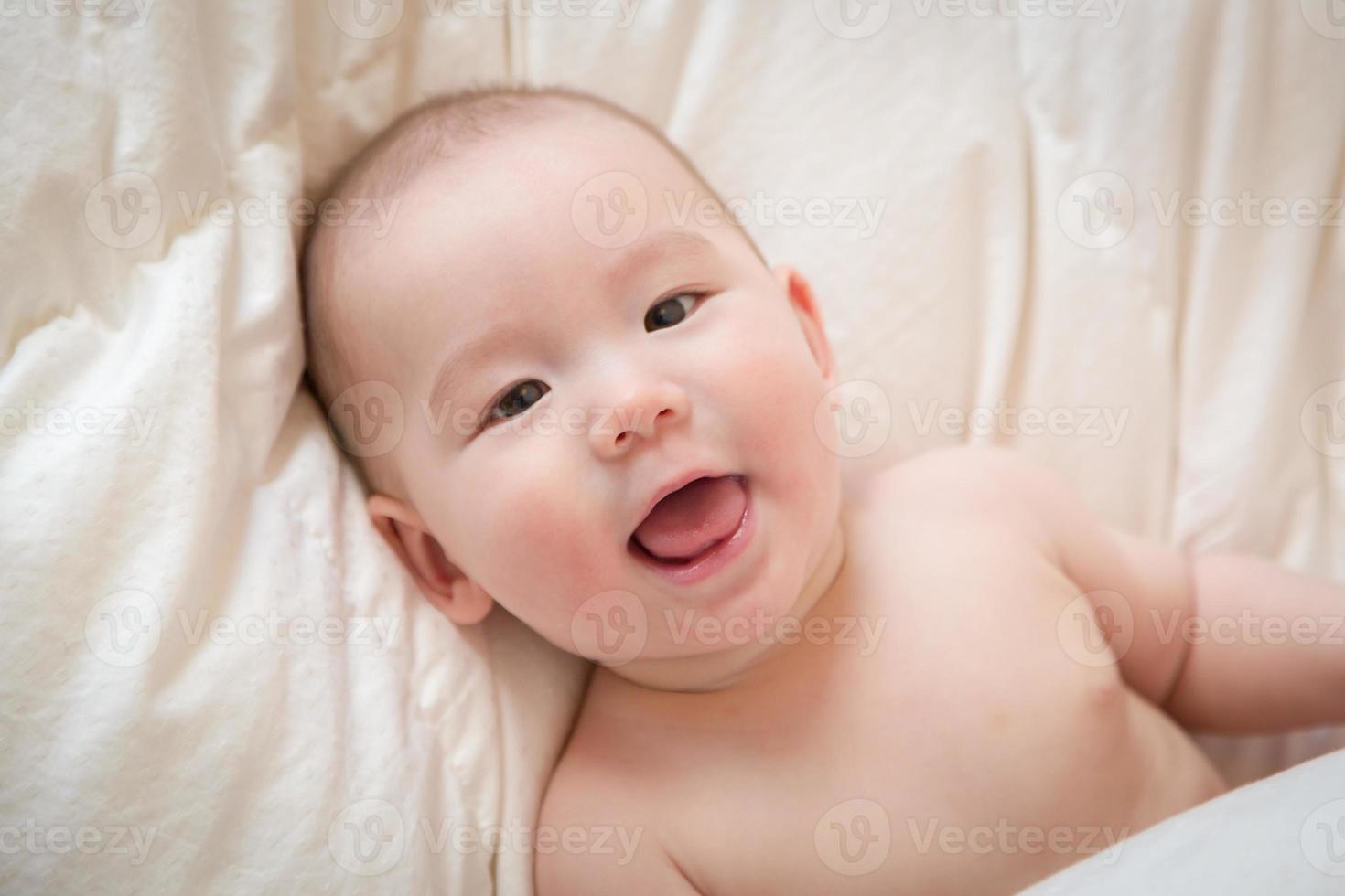 Mixed Race Baby Boy Having Fun on His Blanket photo
