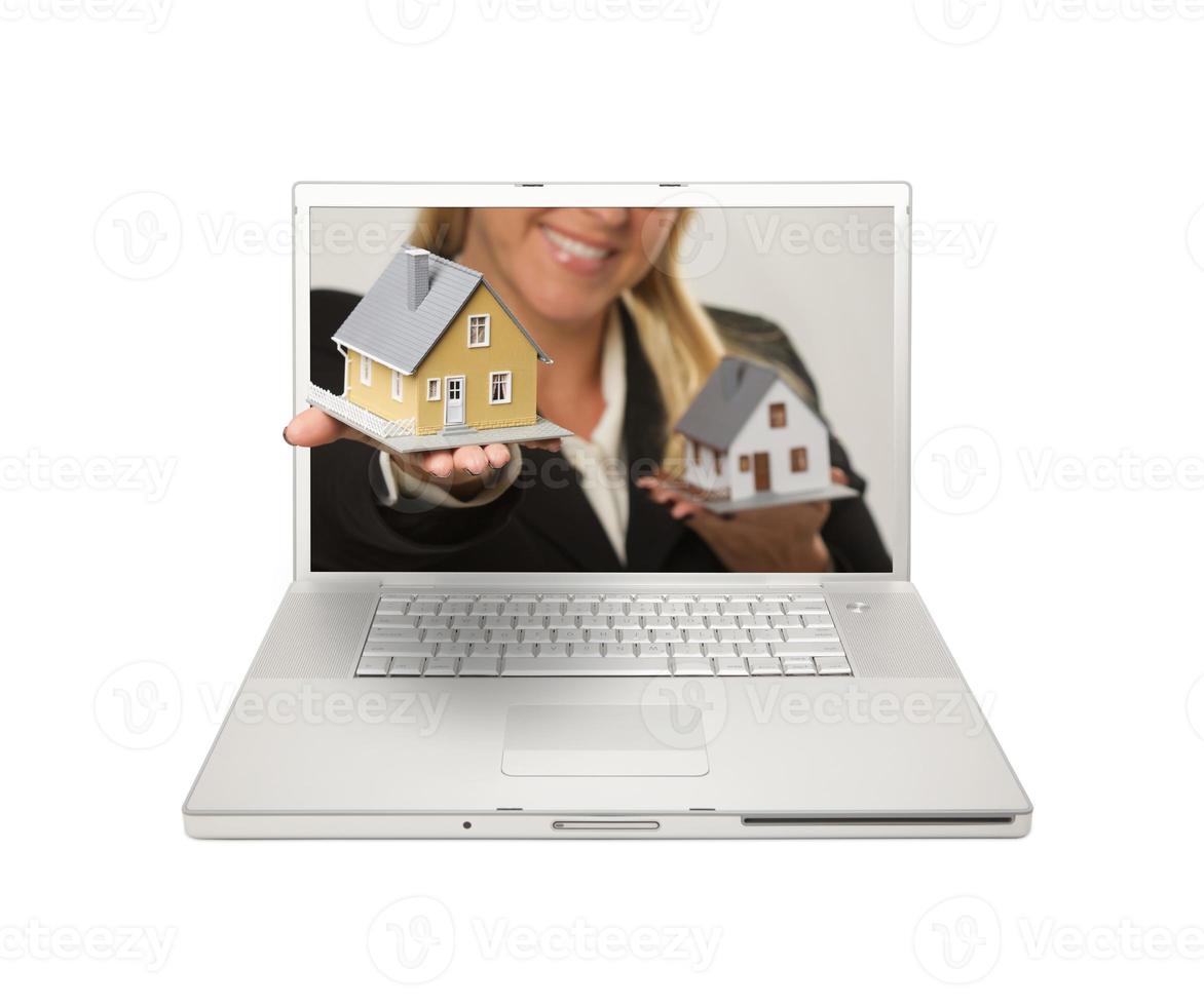 Woman Handing House Through Laptop Screen photo