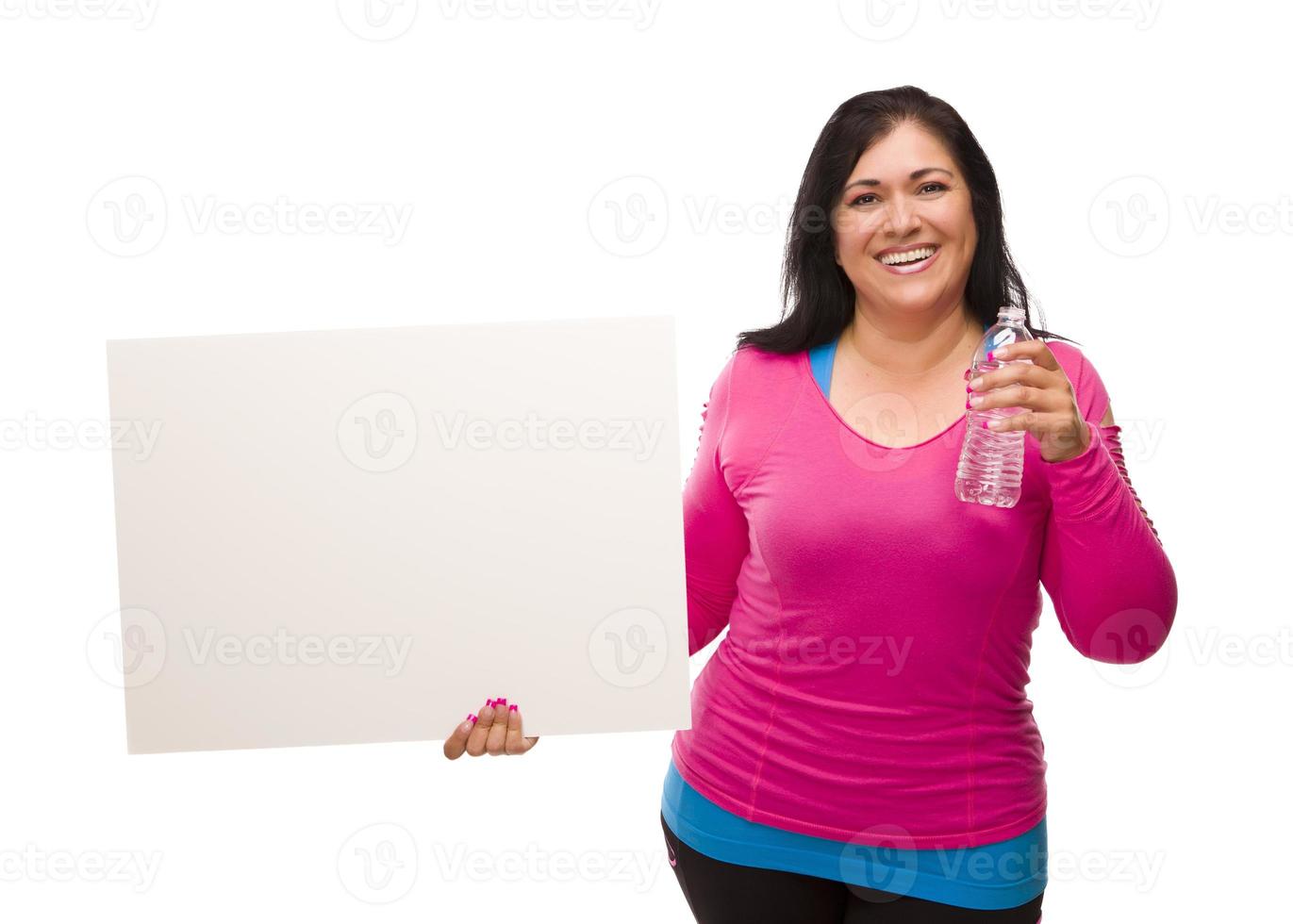 Hispanic Woman In Workout Clothes with Water and Blank Sign photo