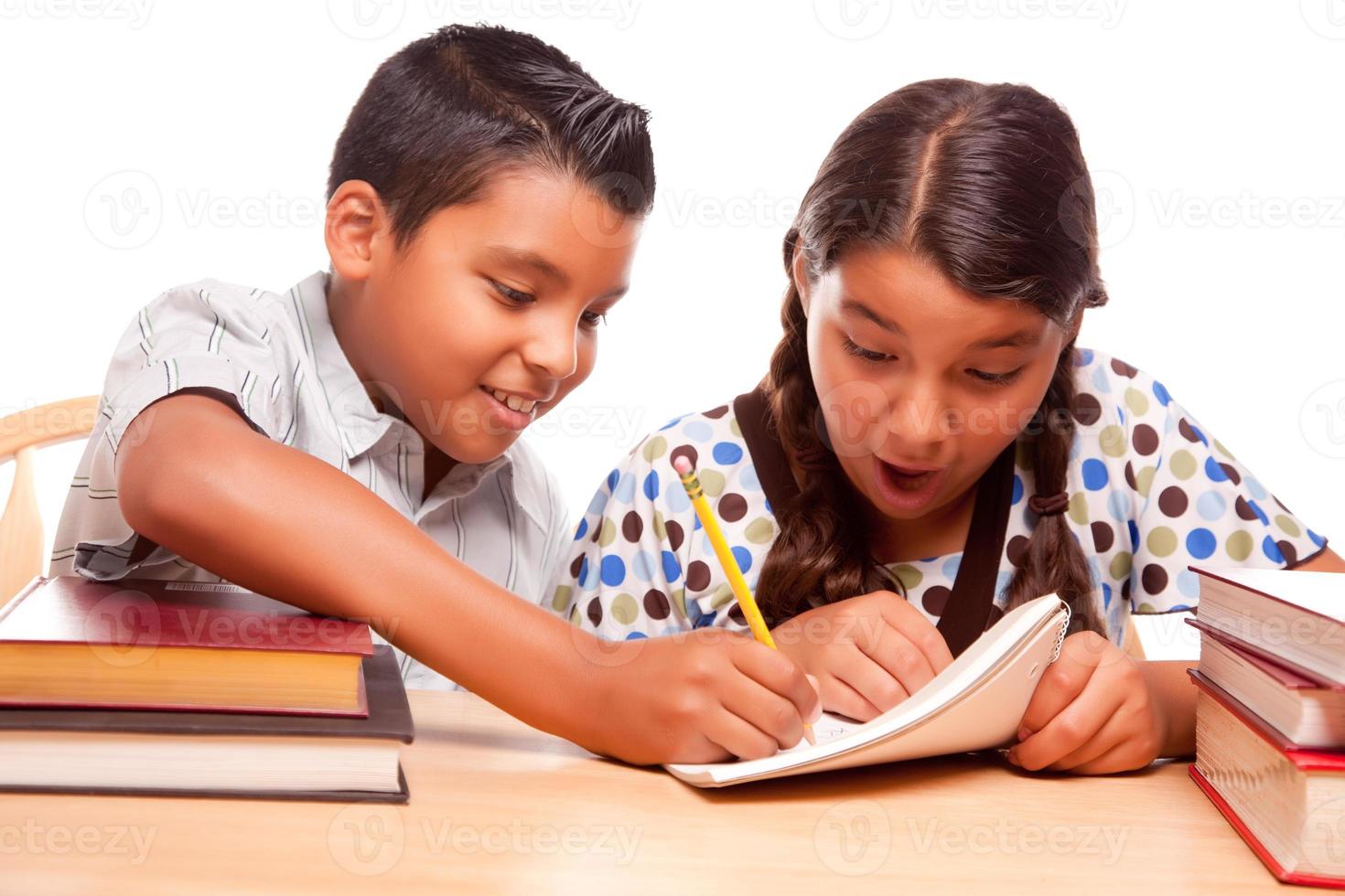 Hispanic Brother and Sister Having Fun Studying photo