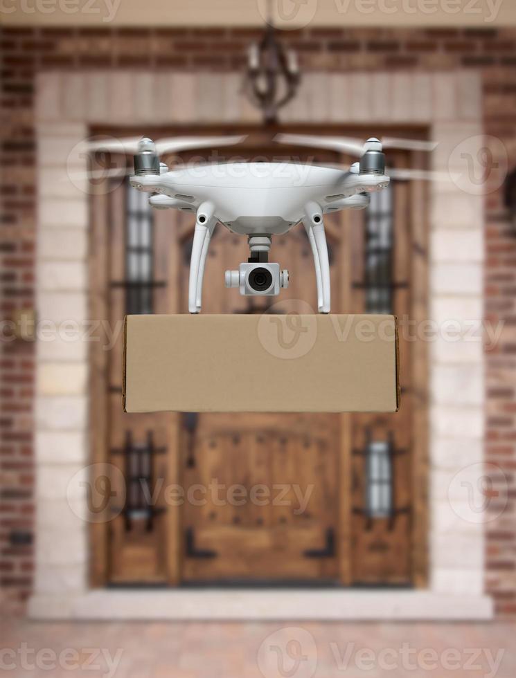 Unmanned Aircraft System UAV Quadcopter Drone Delivering Package To House photo