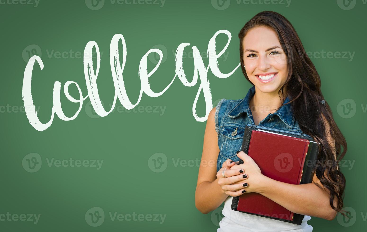 College Written On Chalk Board Behind Mixed Race Young Girl Student Holding Books photo