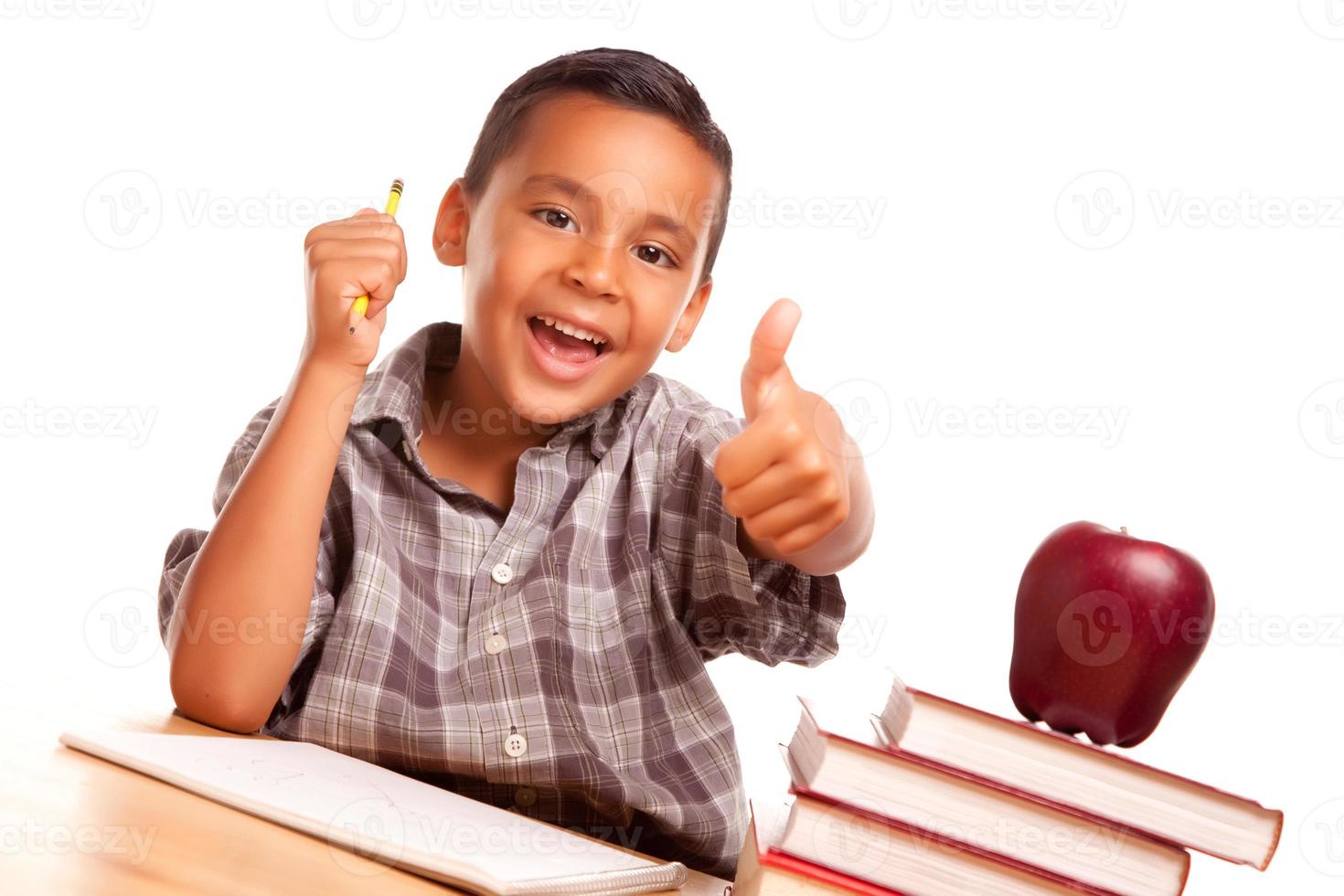 Adorable Hispanic Boy with Books, Apple, Pencil and Paper photo