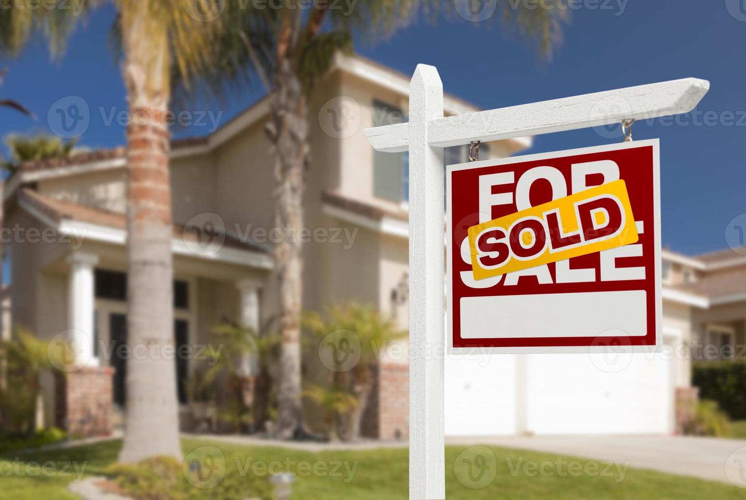 Sold Home For Sale Sign in Front of New House photo