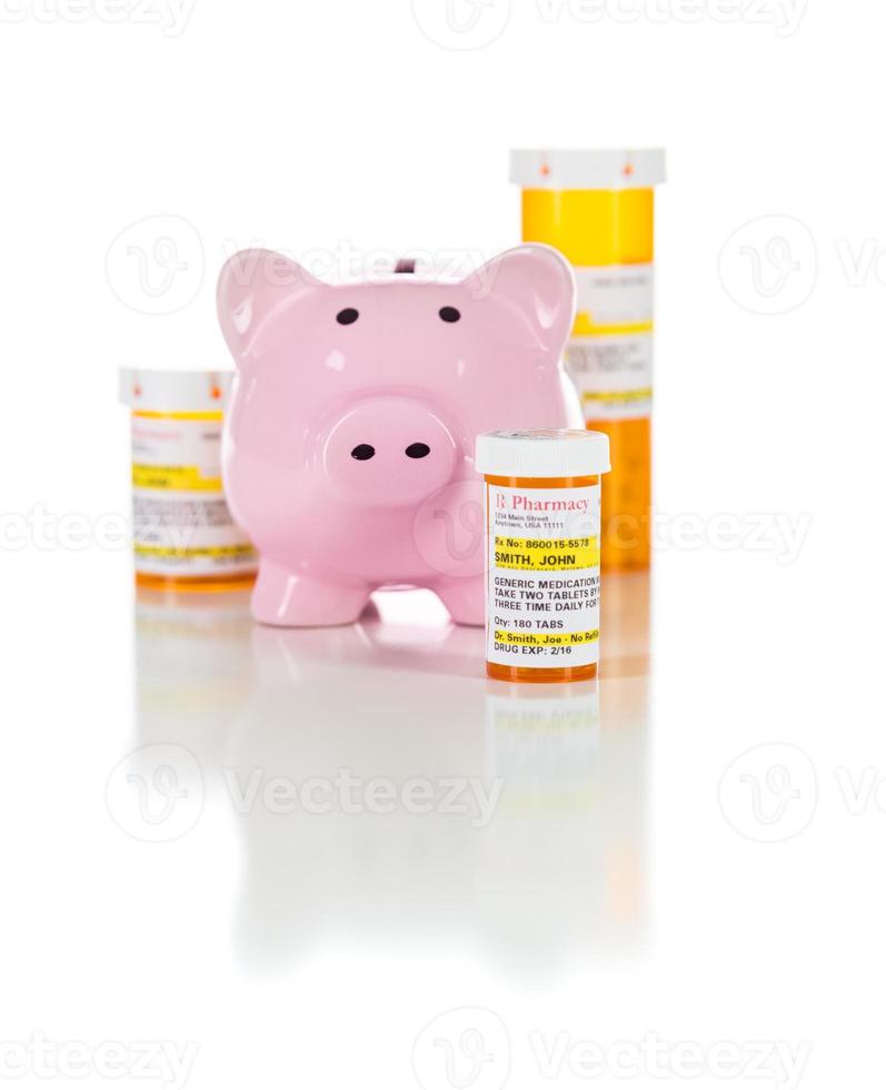 Piggy Bank and Non-Proprietary Medicine Prescription Bottles Isolated on White photo