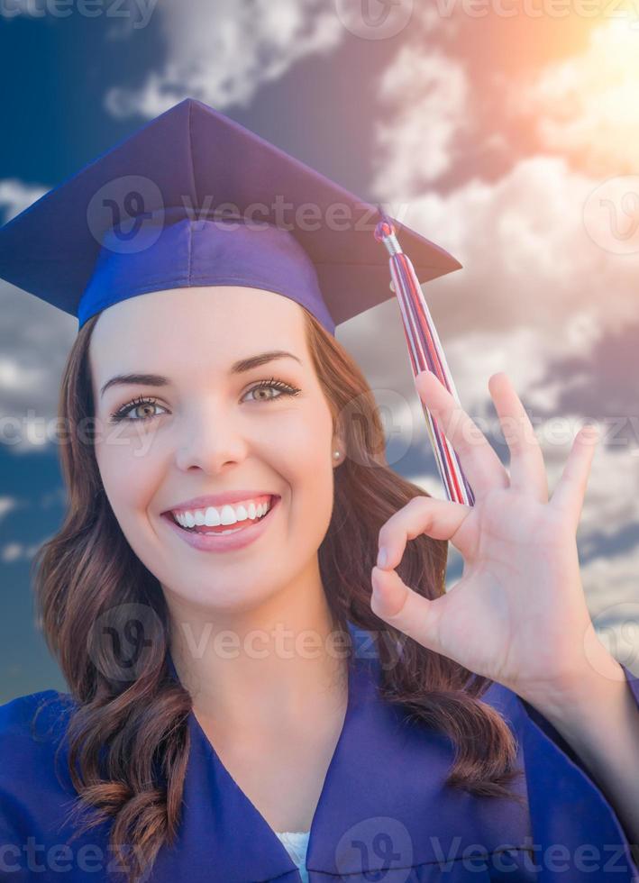 Happy Graduating Mixed Race Woman In Cap and Gown photo
