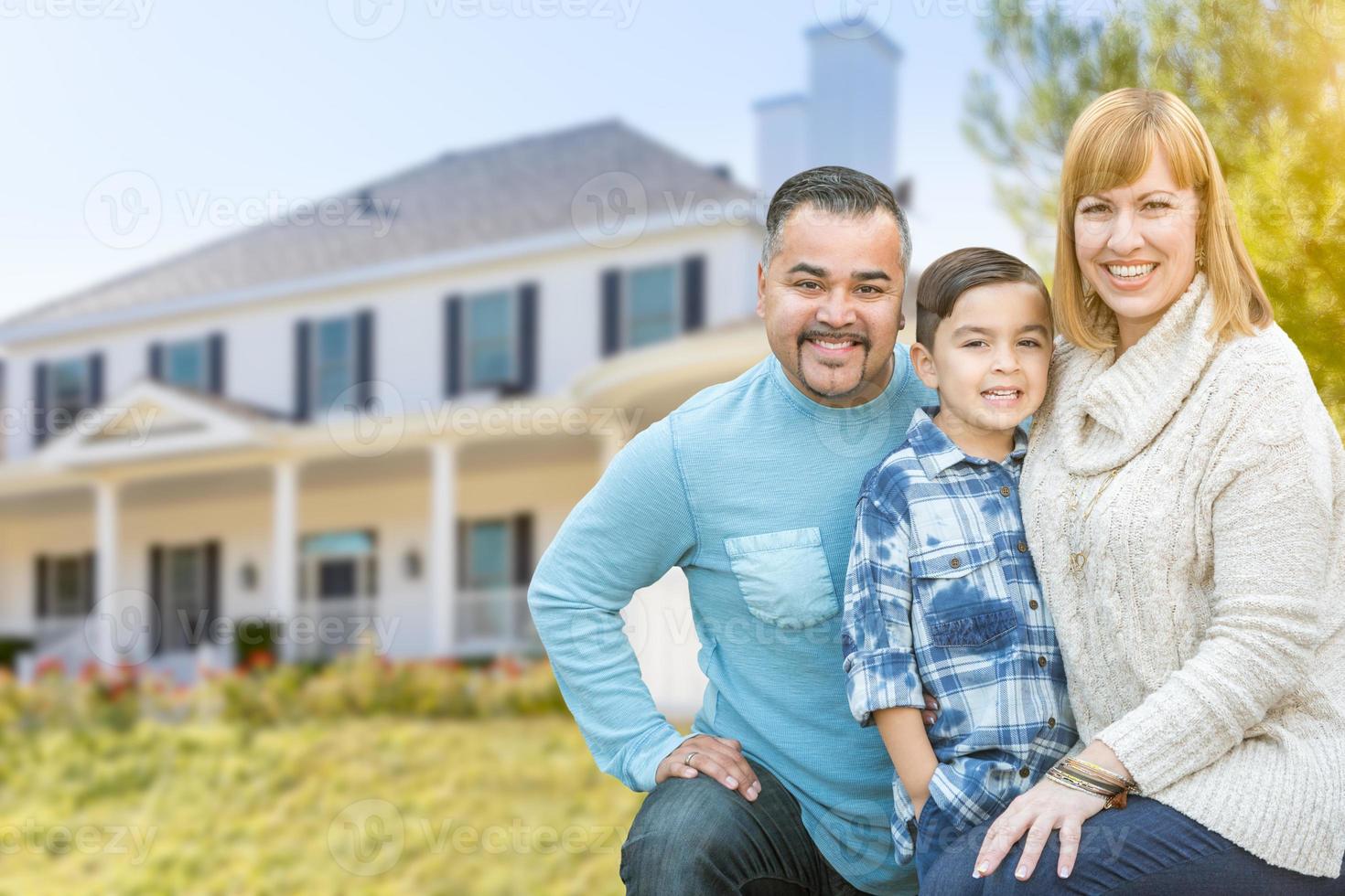 Mixed Race Family Portrait In Front of House photo