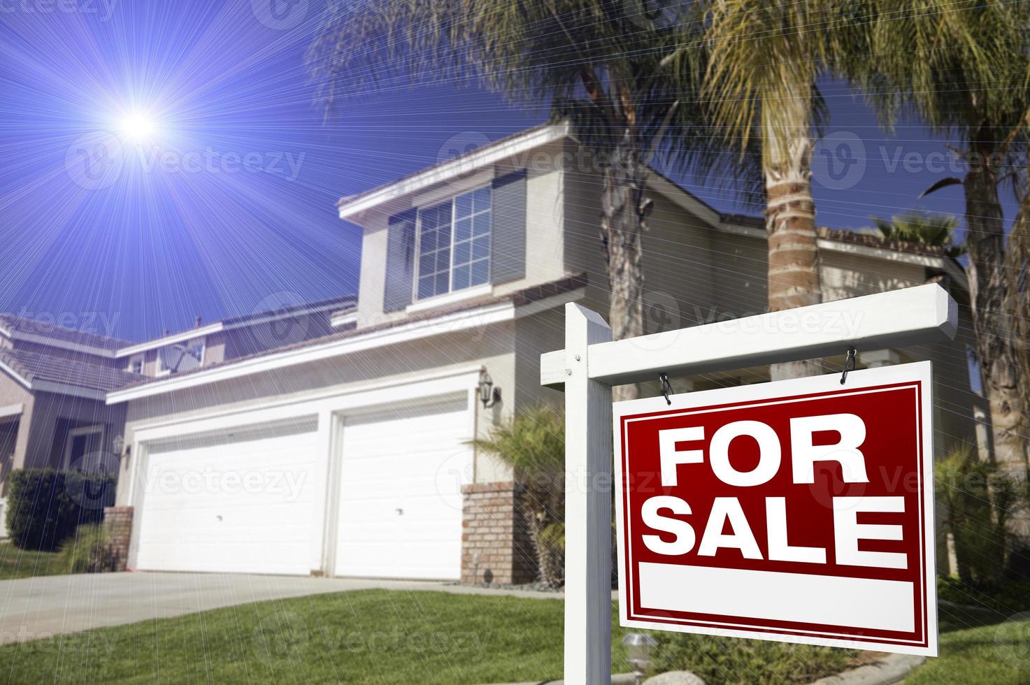 Red For Sale Real Estate Sign and House photo