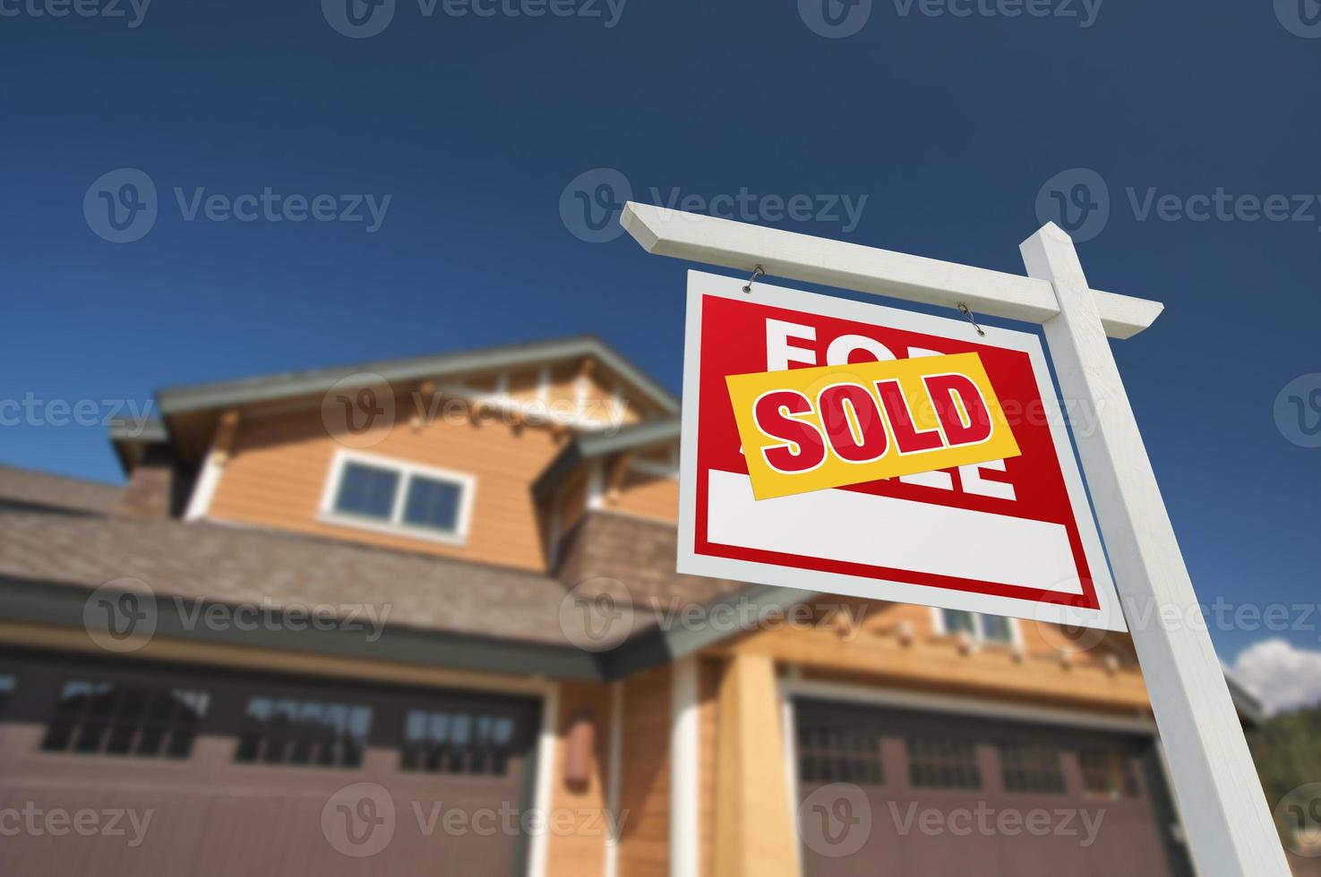 Sold Home For Sale Sign in Front of New House photo